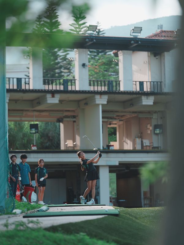 Junior golfers practising at the HKGTA driving range