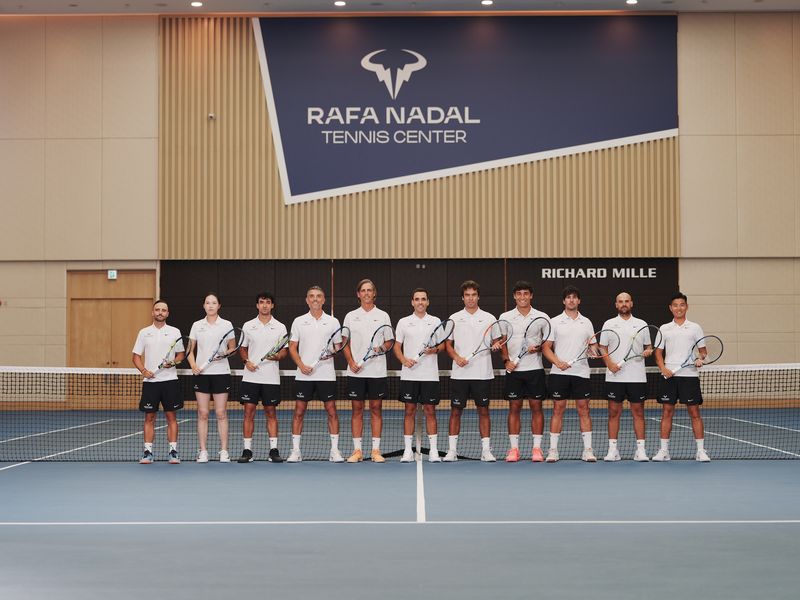 Coaches of the Rafa Nadal Tennis Centre lined up on court at HKGTA